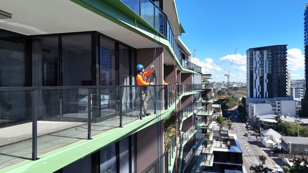 Rope access balcony glass cleaning at 9 Edmondstone St, South Brisbane